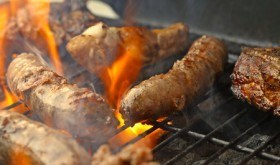pork and beef cooked on a barbeque grill for a low carb barbeque