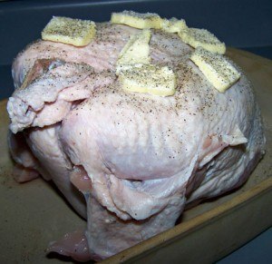 Slather the turkey with butter, salt, pepper and garlic and roast it at 325°